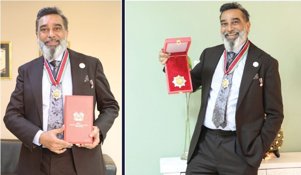 Dr. Amit N. Thakker receiving the Elder of the Order of the Burning Spear Award